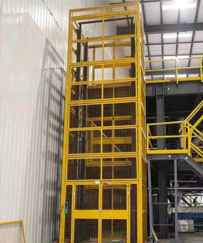 Industrial guide rail hydraulic freight elevator lifting cargo between warehouse floors