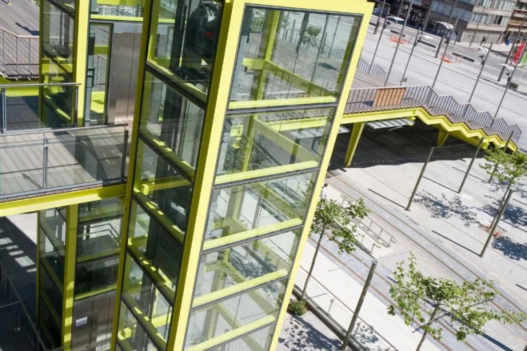 outdoor elevator installation requirements for a steel and glass exterior elevator system