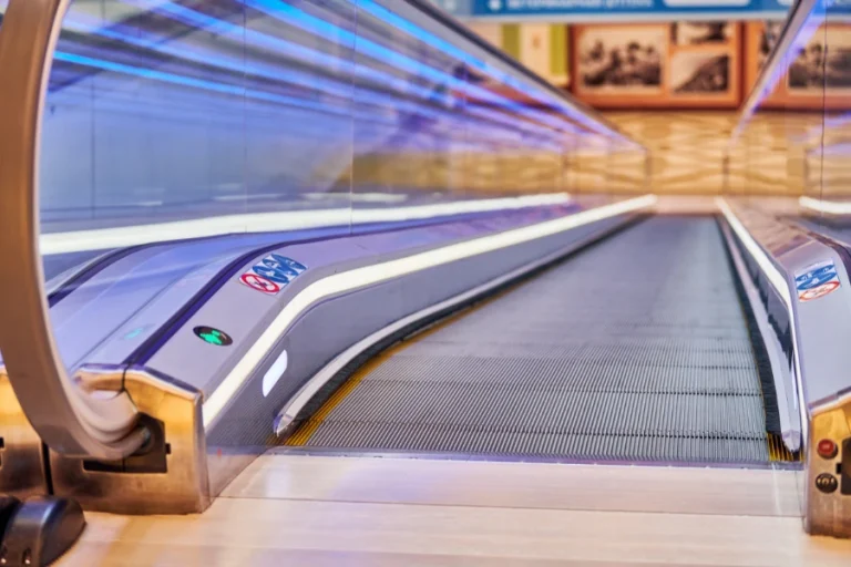 Inclined Moving Walkway installed in a modern shopping mall for smooth passenger and shopping cart transportation